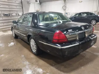 2009 Mercury Grand Marquis LS with VIN 2MEHM75V39X602084, listed as a IAAI auction lot 41615859 with 102,051 mi miles. Bid and sale history available at carsss.com. Image 3.