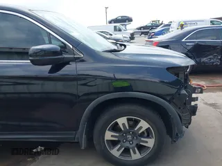 2017 Honda Ridgeline RTL z VIN 5FPYK2F55HB011463, wystawiony jako IAAI lot #42139030 z przebiegiem 59 066 mil mil oraz . Historia ofert i sprzedaży dostępna na DreamBid. Obrazek 18.