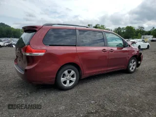 2012 Toyota Sienna LE AAS with VIN 5TDKK3DC4CS253719, listed as a Copart auction lot 63990175 with 155,561 mi miles and Salvage title. Bid and sale history available at DreamBid. Image 3.