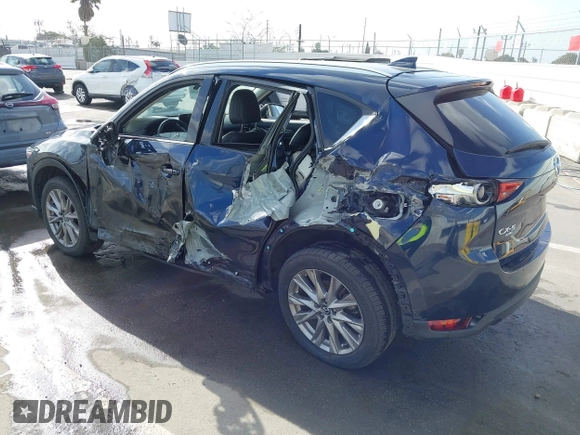 2021 Mazda CX-5 Grand Touring with VIN JM3KFBDM6M1312573, listed as a IAAI auction lot 41936739 with Not Provided miles and . Bid and sale history available at DreamBid. Image 3.