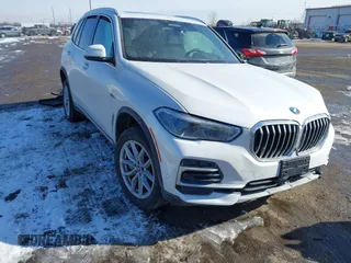 2023 BMW X5 xDrive45e with VIN 5UXTA6C00P9P14126, listed as a IAAI auction lot 41553162 with 36,654 mi miles. Bid and sale history available at carsss.com. Image 1.