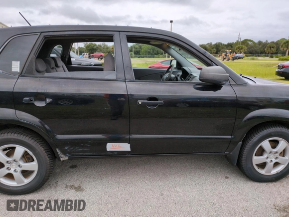 2005 Hyundai Tucson GL with VIN KM8JM12BX5U071182, listed as a Copart auction lot 74852974 with 74,235 mi miles and Salvage Title. Bid and sale history available at carsss.com. Image 13.