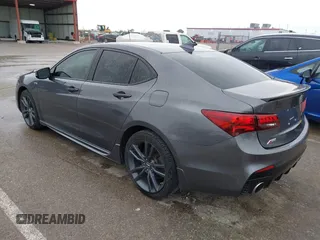 2019 Acura TLX w/A-Spec Pkg z VIN 19UUB2F61KA000932, wystawiony jako IAAI lot #42164064 z przebiegiem 79 080 mil mil oraz . Historia ofert i sprzedaży dostępna na DreamBid. Obrazek 3.
