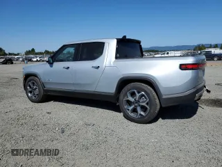 2023 Rivian R1T Adventure z VIN 7FCTGBAA0PN025046, wystawiony jako Copart lot #62502274 z przebiegiem 1385 mil mil oraz Szkody całkowita. Historia ofert i sprzedaży dostępna na DreamBid. Obrazek 2.