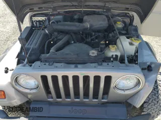 2000 Jeep Wrangler SE with VIN 1J4FA29P7YP737289, listed as a Copart auction lot 61869865 with 91,097 mi miles and Salvage title. Bid and sale history available at DreamBid. Image 11.