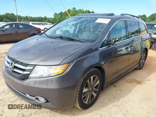 2015 Honda Odyssey Touring Elite z VIN 5FNRL5H97FB060981, wystawiony jako IAAI lot #42289631 z przebiegiem 160 947 mil mil oraz . Historia ofert i sprzedaży dostępna na DreamBid. Obrazek 2.