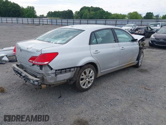 2010 Toyota Avalon XL with VIN 4T1BK3DB6AU369581, listed as a IAAI auction lot 42159063 with 137,996 mi miles and . Bid and sale history available at carsss.com. Image 4.