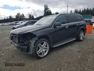 2015 Mercedes-Benz GL-Class GL 550 with VIN 4JGDF7DE5FA498354, listed as a Copart auction lot 47321215 with 100,702 mi miles and Salvage Title. Bid and sale history available at carsss.com. Image 1.