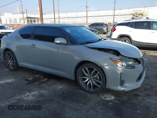 2014 Scion tC with VIN JTKJF5C7XE3079765, listed as a IAAI auction lot 41210220 with 114,410 mi miles. Bid and sale history available at carsss.com. Image 1.