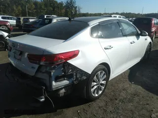 2017 Kia Optima EX with VIN 5XXGU4L32HG156941, listed as a IAAI auction lot 40299001 with 128,592 mi miles. Bid and sale history available at carsss.com. Image 4.
