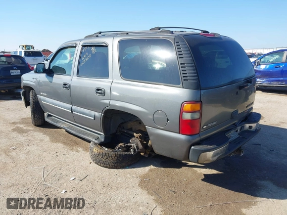 2002 Chevrolet Tahoe LT with VIN 1GNEC13Z12J233208, listed as a IAAI auction lot 41659873 with 238,922 mi miles and . Bid and sale history available at DreamBid. Image 3.