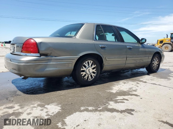 2003 Ford Crown Victoria LX z VIN 2FAFP74W43X123583, wystawiony jako Copart lot #57677555 z przebiegiem 185 336 mil mil oraz Szkoda całkowita • Salvage title. Historia ofert i sprzedaży dostępna na DreamBid. Obrazek 3.