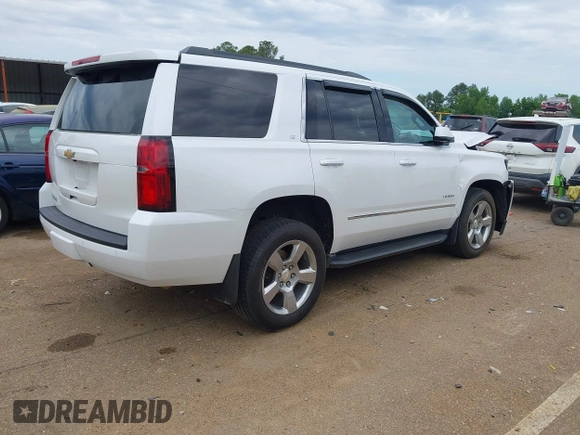 2020 Chevrolet Tahoe LT with VIN 1GNSCBKC4LR181887, listed as a IAAI auction lot 42160821 with 106,757 mi miles and . Bid and sale history available at DreamBid. Image 4.