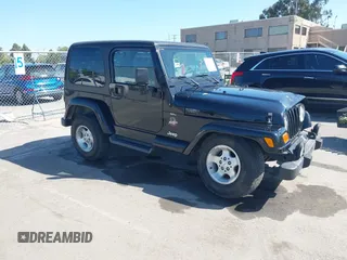 2001 Jeep Wrangler Sahara z VIN 1J4FA59S41P313113, wystawiony jako IAAI lot #42266173 z przebiegiem 125 792 mil mil oraz . Historia ofert i sprzedaży dostępna na DreamBid. Obrazek 1.