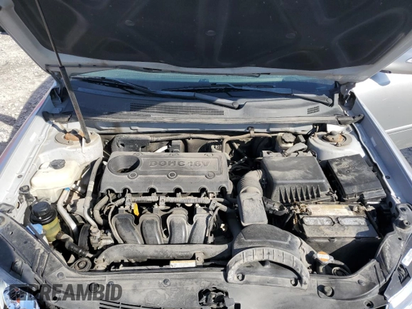 2010 Kia Optima LX z VIN KNAGG4A85A5407416, wystawiony jako Copart lot #71970634 z przebiegiem 194 869 mil mil oraz Szkoda całkowita • Salvage title. Historia ofert i sprzedaży dostępna na DreamBid. Obrazek 11.