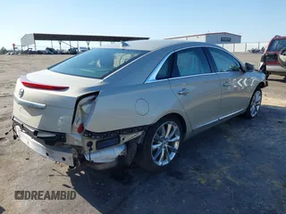 2013 Cadillac XTS Luxury with VIN 2G61P5S39D9172708, listed as a IAAI auction lot 41781371 with 100,173 mi miles. Bid and sale history available at carsss.com. Image 4.
