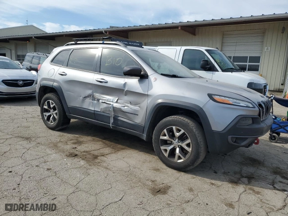 2015 Jeep Cherokee Trailhawk with VIN 1C4PJMBSXFW672073, listed as a Copart auction lot 71289874 with 999,999 mi miles and Clean Title. Bid and sale history available at carsss.com. Image 4.