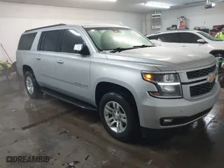 2019 Chevrolet Suburban LT with VIN 1GNSKHKC8KR185851, listed as a IAAI auction lot 41604664 with 96,406 mi miles. Bid and sale history available at carsss.com. Image 1.