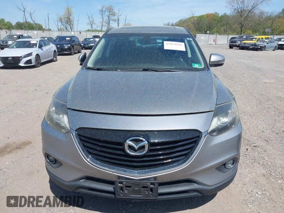 2014 Mazda CX-9 Grand Touring z VIN JM3TB3DV4E0429428, wystawiony jako IAAI lot #42094028 z przebiegiem 147 294 mil mil oraz . Historia ofert i sprzedaży dostępna na DreamBid. Obrazek 12.