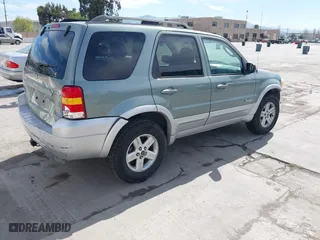 2007 Ford Escape Hybrid with VIN 1FMCU59H37KA92464, listed as a IAAI auction lot 42001479 with 159,147 mi miles. Bid and sale history available at carsss.com. Image 4.