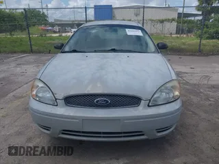 2006 Ford Taurus SE with VIN 1FAFP53U56A209213, listed as a IAAI auction lot 42009423 with 118,083 mi miles. Bid and sale history available at carsss.com. Image 6.