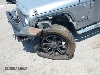 2013 Jeep Wrangler Unlimited Sahara with VIN 1C4BJWEG4DL666930, listed as a IAAI auction lot 42310569 with 206,577 mi miles and . Bid and sale history available at DreamBid. Image 6.
