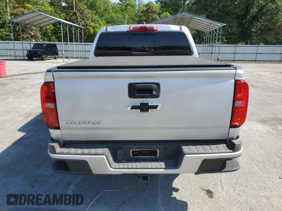 2016 Chevrolet Colorado 4WD Z71 with VIN 1GCGTDE33G1170065, listed as a Copart auction lot 55920665 with 135,410 mi miles and Salvage title. Bid and sale history available at DreamBid. Image 6.