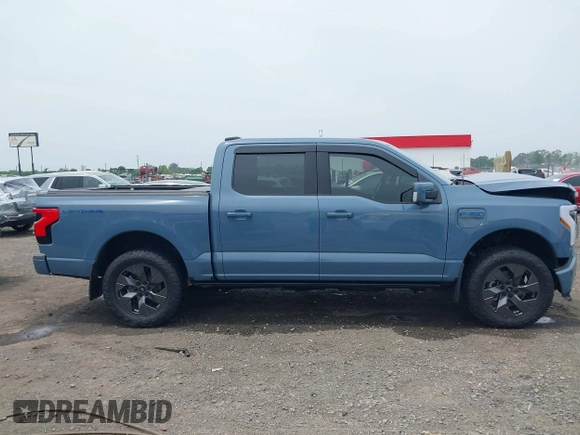 2023 Ford F-150 Lightning Pro with VIN 1FT6W1EVXPWG53591, listed as a IAAI auction lot 42249385 with 17,892 mi miles and . Bid and sale history available at DreamBid. Image 13.