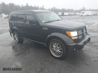 2011 Dodge Nitro Heat with VIN 1D4PU4GX9BW537756, listed as a IAAI auction lot 41671809 with 122,256 mi miles. Bid and sale history available at carsss.com. Image 1.