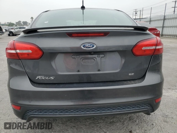 2016 Ford Focus SE z VIN 1FADP3F23GL405565, wystawiony jako Copart lot #60173935 z przebiegiem 82 167 mil mil oraz Szkoda całkowita • Salvage title. Historia ofert i sprzedaży dostępna na DreamBid. Obrazek 6.