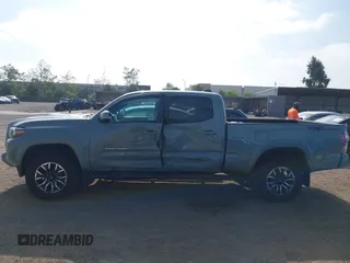 2022 Toyota Tacoma SR5 z VIN 3TMBZ5DN3NM034388, wystawiony jako IAAI lot #42270543 z przebiegiem 179 904 mil mil oraz . Historia ofert i sprzedaży dostępna na DreamBid. Obrazek 14.