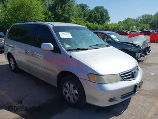 2004 Honda Odyssey EX-L with VIN 5FNRL18934B018040, listed as a IAAI auction lot 42241081 with 250,607 mi miles and . Bid and sale history available at DreamBid. Image 1.
