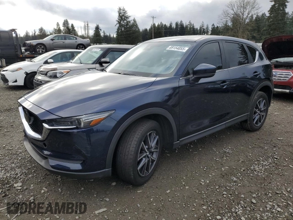 2018 Mazda CX-5 Touring with VIN JM3KFACM8J1349356, listed as a Copart auction lot 89154055 with 82,719 mi miles and Salvage Title. Bid and sale history available at carsss.com. Image 1.
