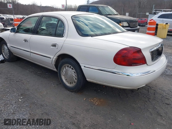 1998 Lincoln Continental with VIN 1LNFM97VXWY619313, listed as a IAAI auction lot 41477852 with 158,973 mi miles. Bid and sale history available at carsss.com. Image 3.