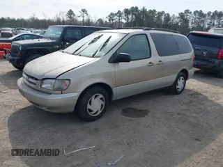2000 Toyota Sienna LE z VIN 4T3ZF13C1YU211572, wystawiony jako IAAI lot #41724715 z przebiegiem 265 622 mil mil oraz . Historia ofert i sprzedaży dostępna na DreamBid. Obrazek 2.