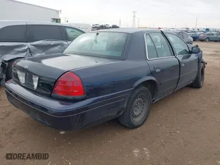 2001 Ford Crown Victoria Police Pkg Police Interceptor with VIN 2FAFP71W01X198332, listed as a IAAI auction lot 41474334 with 141,148 mi miles. Bid and sale history available at carsss.com. Image 4.