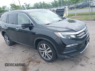 2017 Honda Pilot Touring z VIN 5FNYF6H90HB052474, wystawiony jako IAAI lot #42291464 z przebiegiem 103 288 mil mil oraz . Historia ofert i sprzedaży dostępna na DreamBid. Obrazek 1.