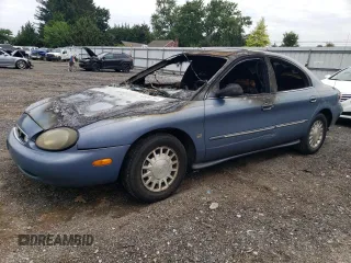 1999 Mercury Sable LS z VIN 1MEFM53S4XG649132, wystawiony jako Copart lot #70168934 z przebiegiem Nie podano mil oraz Nie do naprawy. Historia ofert i sprzedaży dostępna na DreamBid. Obrazek 1.
