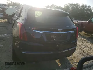 2022 Cadillac XT5 FWD Luxury z VIN 1GYKNAR49NZ159814, wystawiony jako Copart lot #74506584 z przebiegiem 7 069 mil mil oraz Nie do naprawy • Non repairable. Historia ofert i sprzedaży dostępna na DreamBid. Obrazek 6.