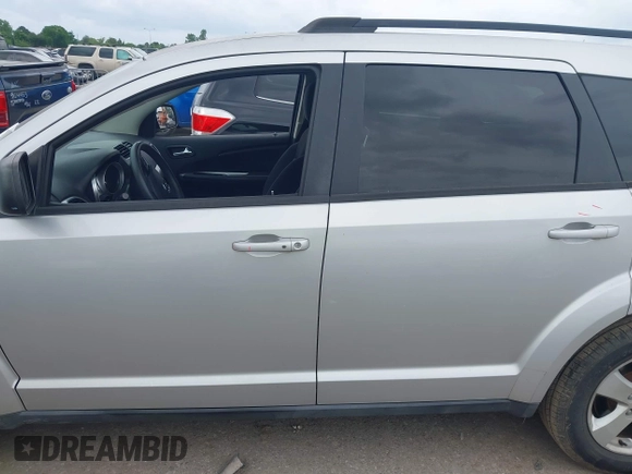2013 Dodge Journey SE z VIN 3C4PDCAB9DT529668, wystawiony jako IAAI lot #42130654 z przebiegiem 156 472 mil mil oraz . Historia ofert i sprzedaży dostępna na DreamBid. Obrazek 15.