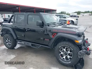 2021 Jeep Wrangler Unlimited Rubicon with VIN 1C4HJXFG7MW662092, listed as a IAAI auction lot 42139521 with 32,055 mi miles and . Bid and sale history available at carsss.com. Image 17.