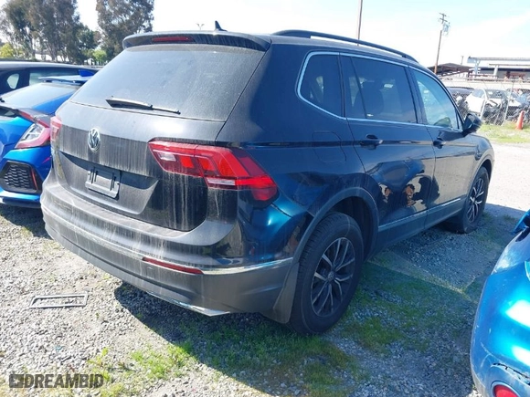 2021 Volkswagen Tiguan SE with VIN 3VV3B7AX0MM129887, listed as a IAAI auction lot 40565638 with 84,790 mi miles. Bid and sale history available at carsss.com. Image 4.