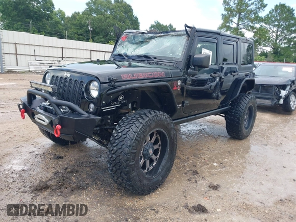 2015 Jeep Wrangler Unlimited Rubicon Hard Rock with VIN 1C4HJWFG0FL674700, listed as a IAAI auction lot 42511949 with 138,370 mi miles and . Bid and sale history available at DreamBid. Image 2.