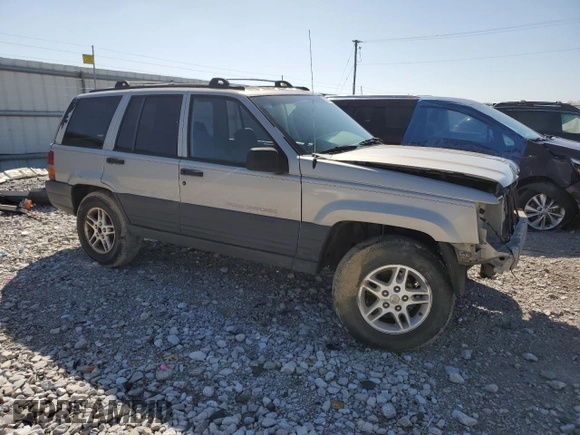 1997 Jeep Grand Cherokee Laredo with VIN 1J4GZ58S5VC561060, listed as a Copart auction lot 52098315 with 267,245 mi miles and Salvage title. Bid and sale history available at DreamBid. Image 4.