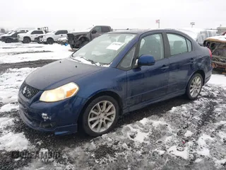 2009 Suzuki SX4 Sport FWD with VIN JS2YC414196202090, listed as a IAAI auction lot 41582385 with 160,838 mi miles and . Bid and sale history available at DreamBid. Image 2.