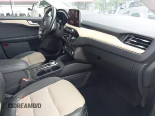 2021 Ford Escape Titanium with VIN 1FMCU9J93MUA36648, listed as a IAAI auction lot 42055229 with 122,864 mi miles and . Bid and sale history available at carsss.com. Image 5.