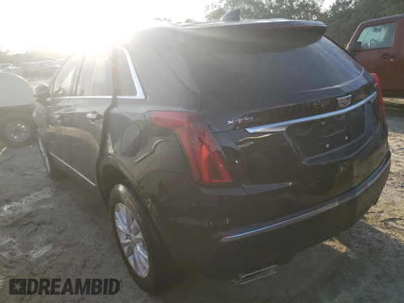 2022 Cadillac XT5 FWD Luxury z VIN 1GYKNAR49NZ159814, wystawiony jako Copart lot #74506584 z przebiegiem 7 069 mil mil oraz Nie do naprawy • Non repairable. Historia ofert i sprzedaży dostępna na DreamBid. Obrazek 2.