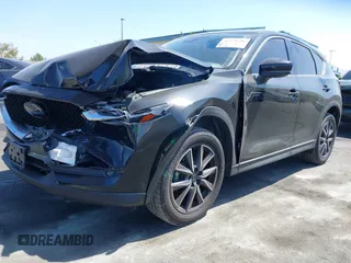 2018 Mazda CX-5 Grand Touring z VIN JM3KFADM7J0327272, wystawiony jako IAAI lot #42279536 z przebiegiem 97 478 mil mil oraz . Historia ofert i sprzedaży dostępna na DreamBid. Obrazek 17.