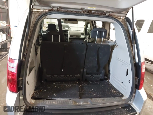 2010 Dodge Grand Caravan SXT with VIN 2D4RN5D15AR261319, listed as a IAAI auction lot 41877022 with 142,292 mi miles and . Bid and sale history available at DreamBid. Image 17.