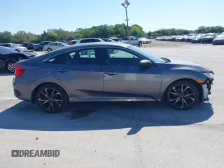 2019 Honda Civic Sport with VIN 19XFC2F89KE019683, listed as a IAAI auction lot 42055871 with 107,941 mi miles and . Bid and sale history available at DreamBid. Image 14.